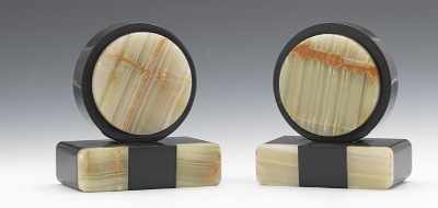 Appraisal: A Pair of Art Deco Onyx Bookends Circular two-tone polished