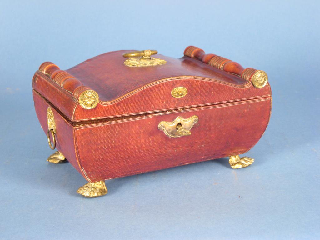 Appraisal: A Regency leather Jewel Casket the shaped lid with half