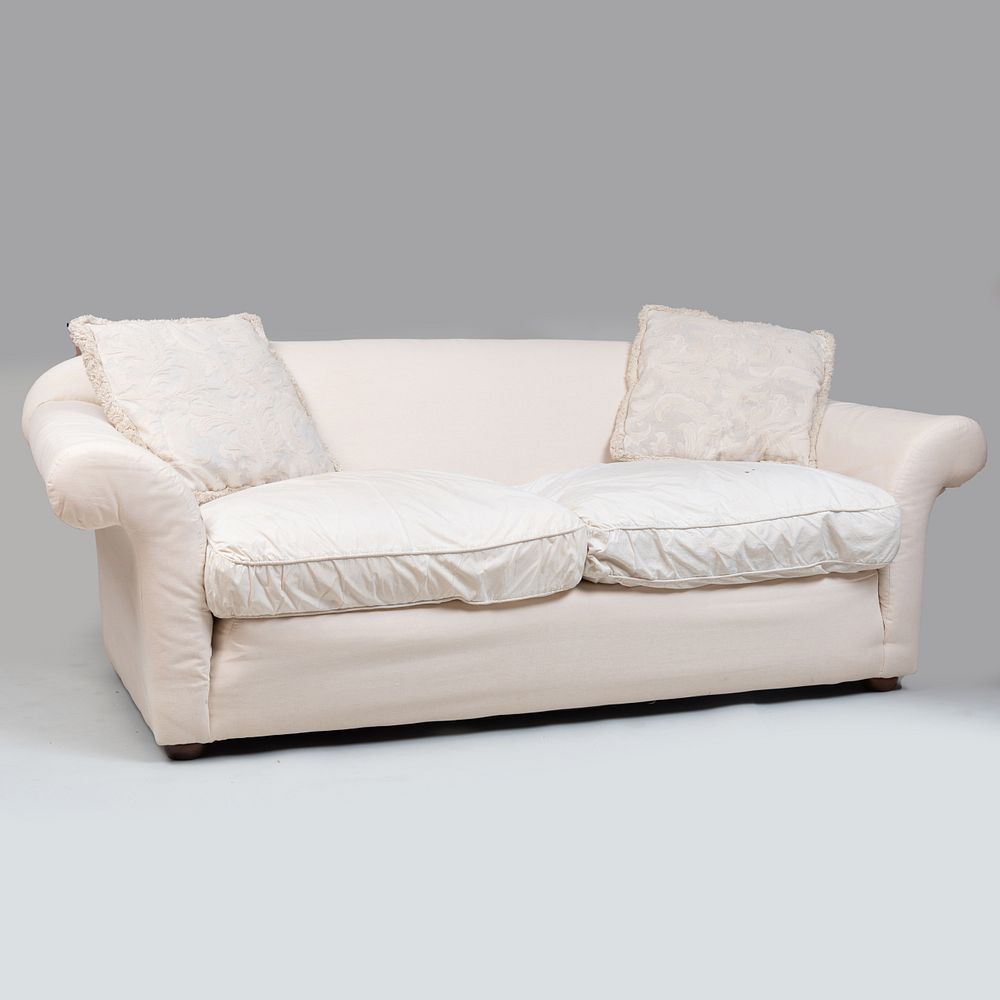 Appraisal: Large Muslin Upholstered Sofa With two pillows x ft x