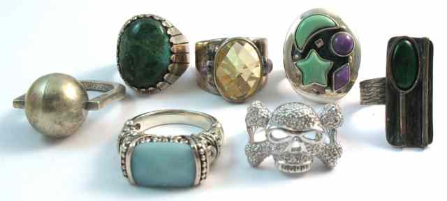 Appraisal: A COLLECTION OF SEVEN RINGS various styles with green stones