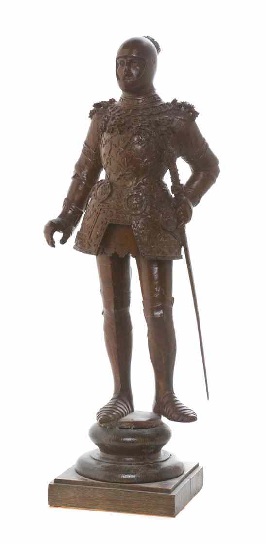 Appraisal: A Continental Carved Wood Figure depicting a standing European knight