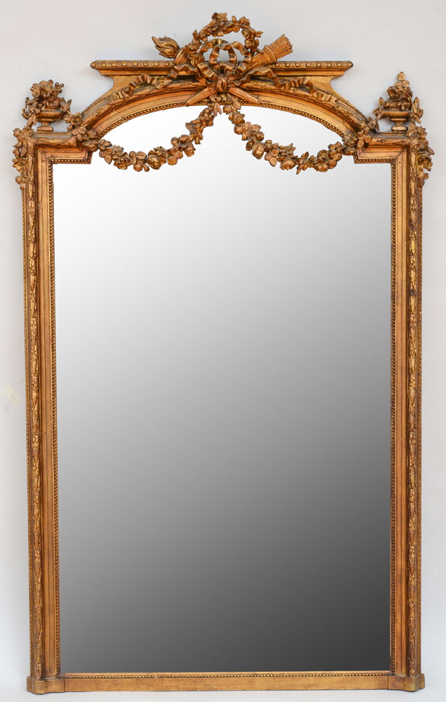 Appraisal: LOUIS XVI STYLE GILTWOOD MIRROR With an arched mirror plate