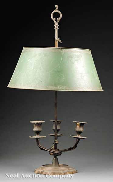 Appraisal: A French Brass Bouillotte Lamp with T le Peinte Shade