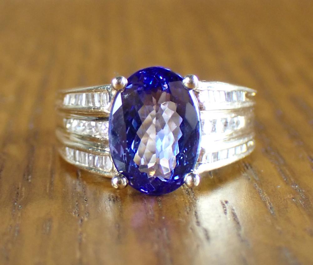 Appraisal: TANZANITE DIAMOND AND FOURTEEN KARAT GOLD RING with three rows