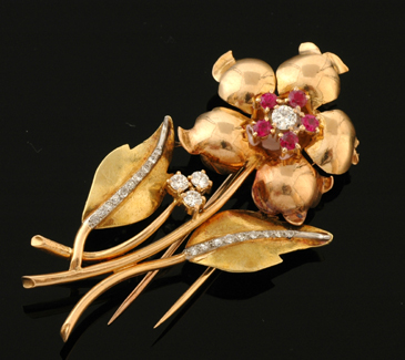 Appraisal: A gold diamond and ruby cocktail brooch Circa The ct