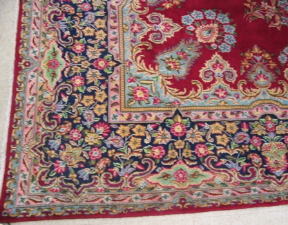 Appraisal: PERSIAN KERMAN CARPET floral and floral decoration on crimson ground