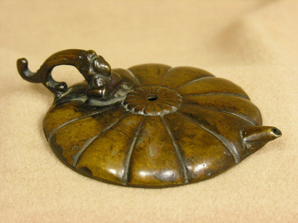 Appraisal: EARLY BRONZE OIL LAMP Age unknown Condition Good patina Size