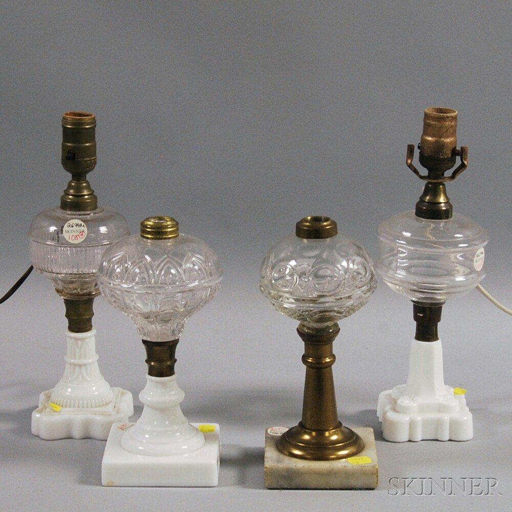 Appraisal: Four Pressed Pattern Glass Fluid Lamps America mid- th century