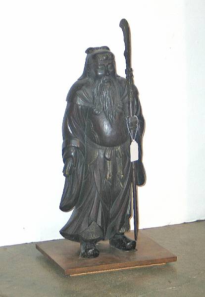 Appraisal: A large carved wood figure of Guanyu The heroic general