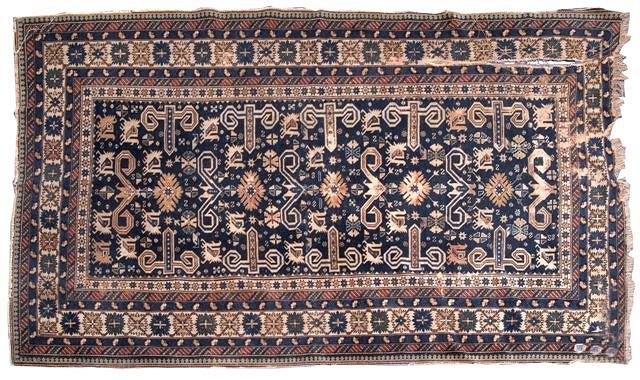 Appraisal: A KASAK BLUE GROUND RUG decorated a continuing pattern of