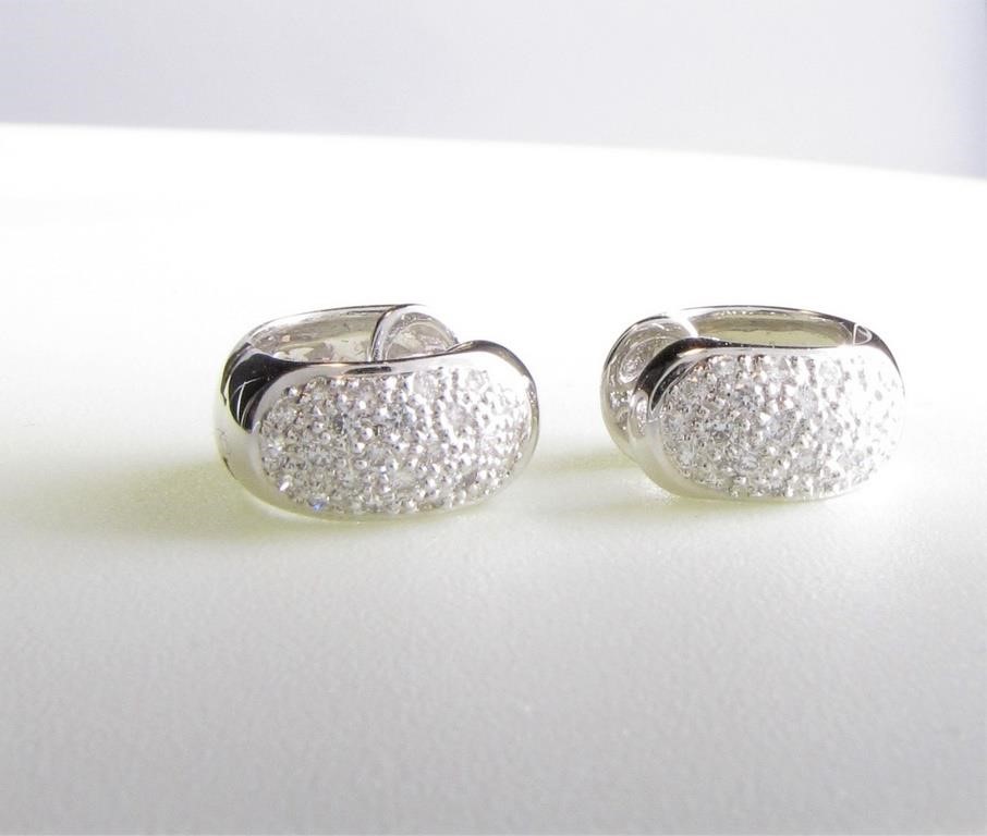 Appraisal: A pair of K white gold huggie earrings featuring approximately