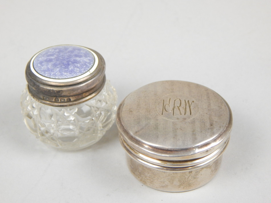 Appraisal: Two small dressing table jars one silver with engine turned