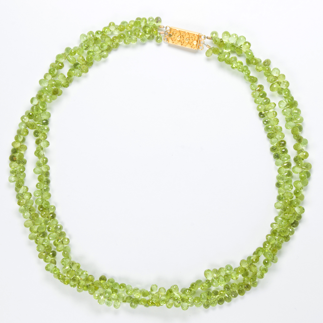 Appraisal: A PERIDOT AND EIGHTEEN KARAT GOLD NECKLACE A peridot and