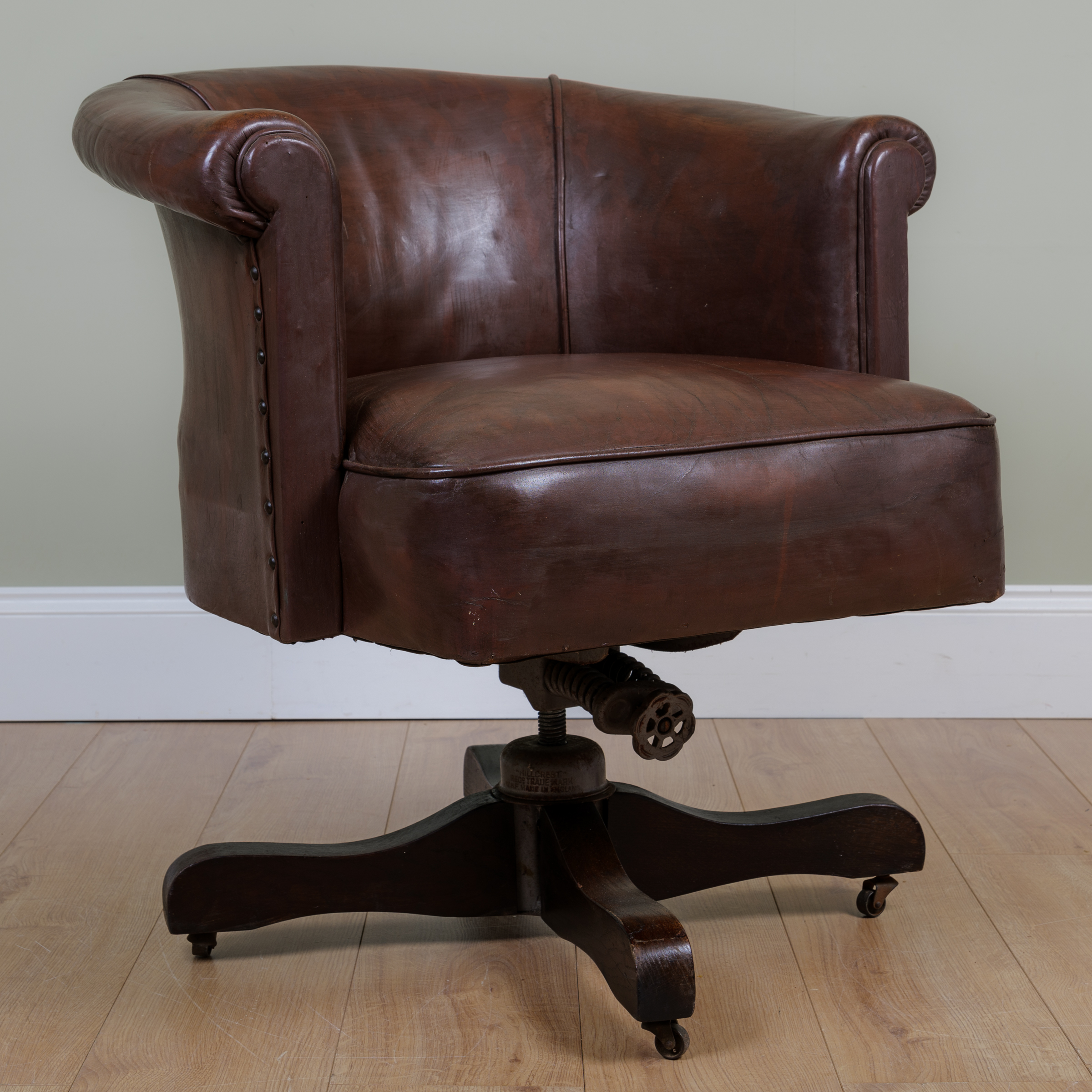 Appraisal: A Hillcrest leather desk chair with studded detail to sides