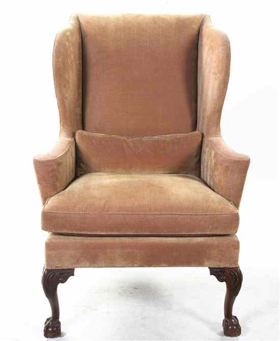 Appraisal: A Chippendale Style Wingback Armchair having an upholstered back arms