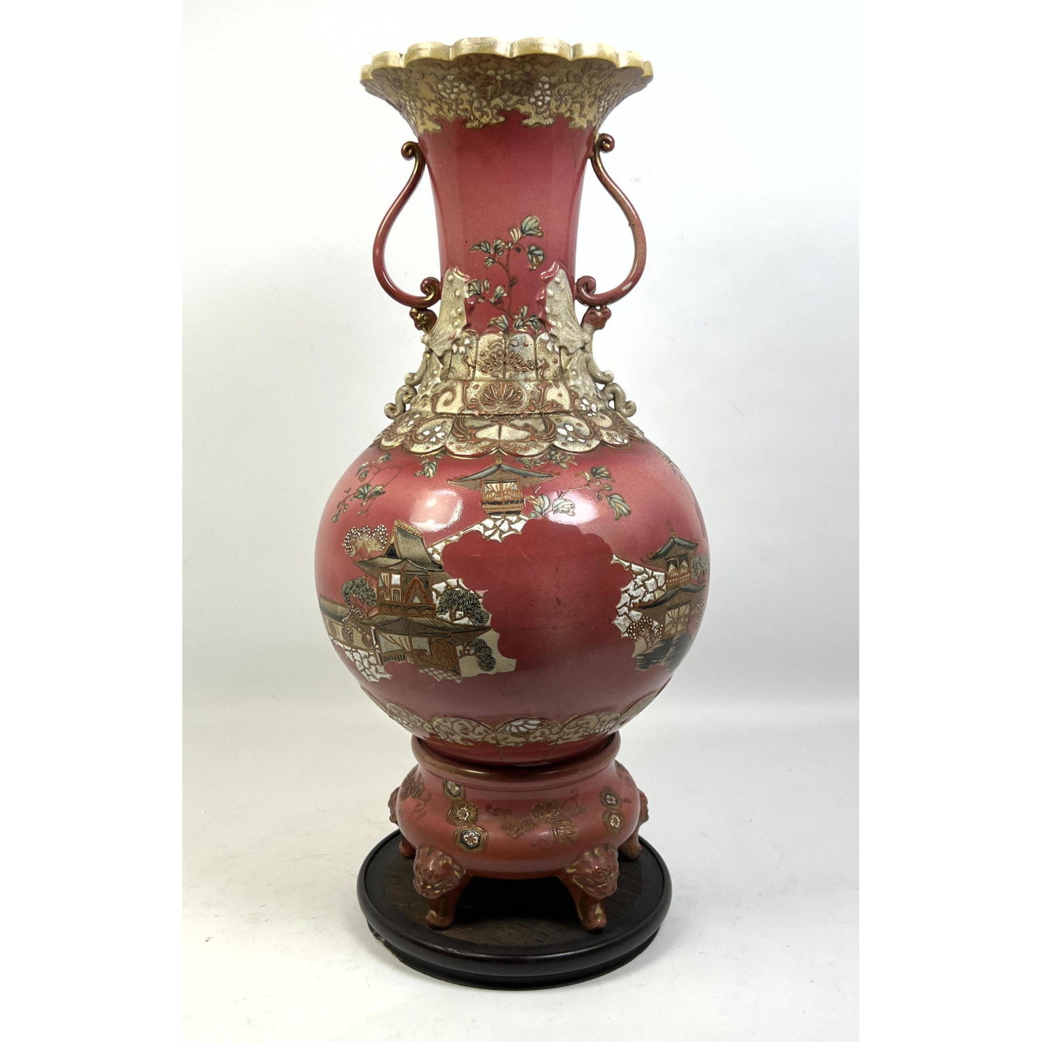 Appraisal: Porcelain Handled Vase Urn Richly decorated Figural feet wood base