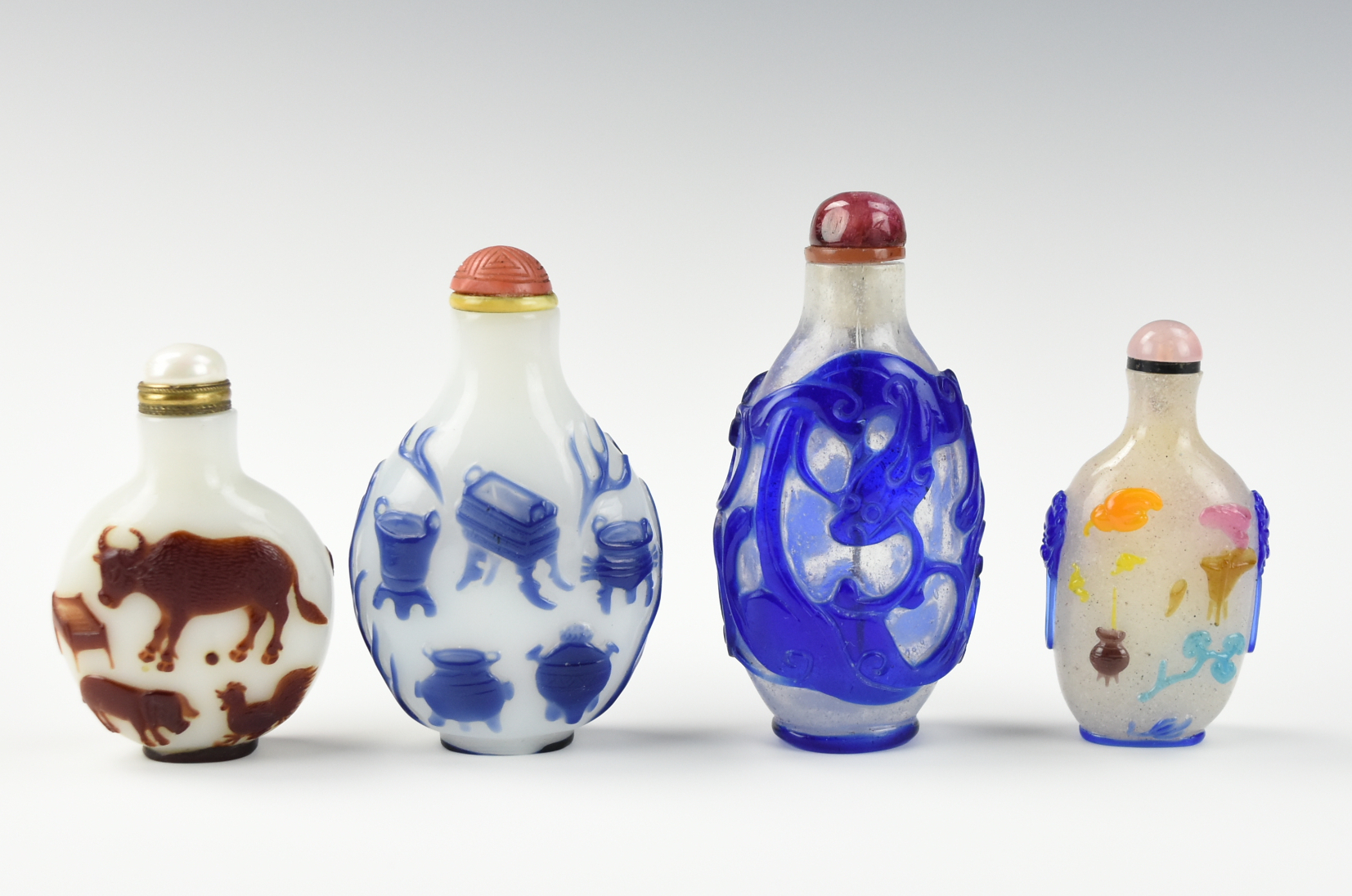 Appraisal: FOUR CHINESE GLASSWARE SNUFF BOTTLES four Chinese th C snuff