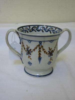 Appraisal: AN ENGLISH PEARLWARE BALUSTER LOVING CUP painted in blue and