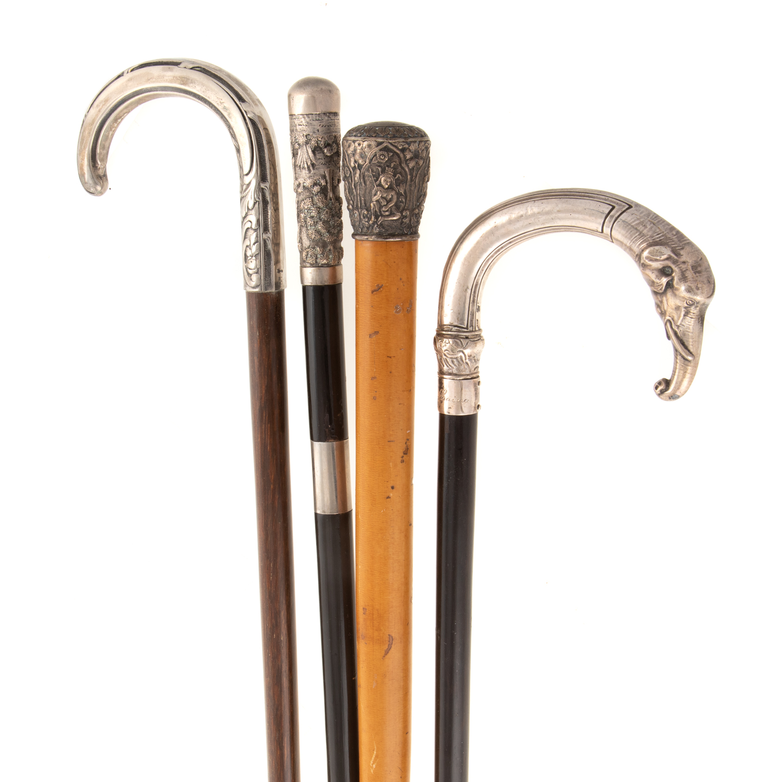 Appraisal: FOUR SILVER-MOUNTED WALKING STICKS Including one with Portuguese silver handle