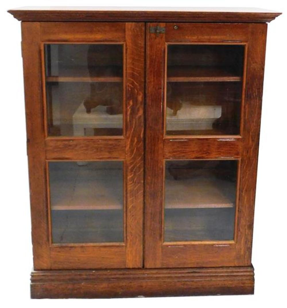 Appraisal: Arts Crafts glass door bookcase c oak oblong top with