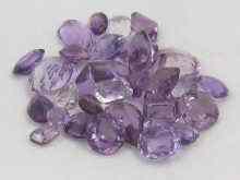 Appraisal: A quantity of loose polished amethyst mixed cuts and sizes