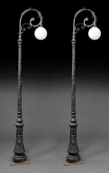 Appraisal: A set of four cast iron lamps The arched lamp