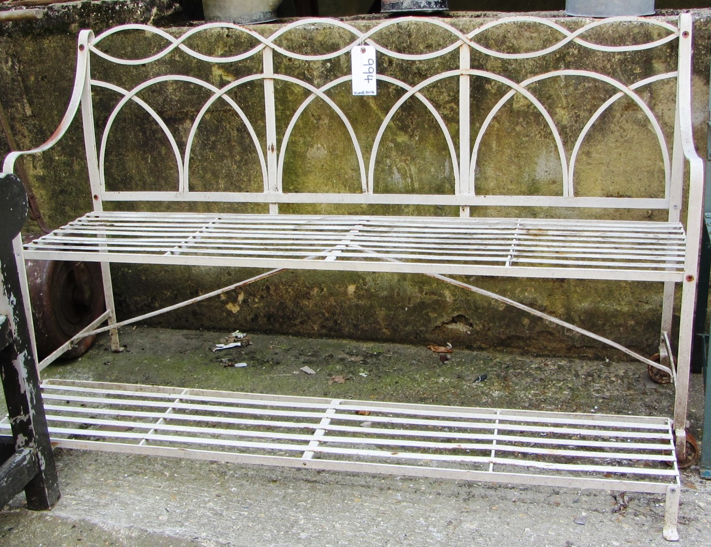 Appraisal: A Regency style cream painted iron bench with integral foot