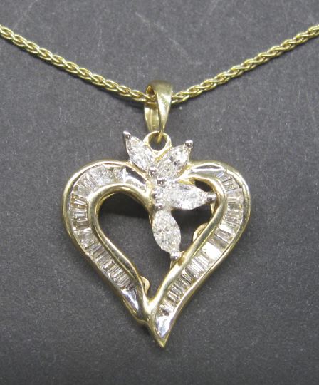 Appraisal: Fourteen-Karat Yellow Gold and Diamond Heart-Shaped Pendant and Chain the