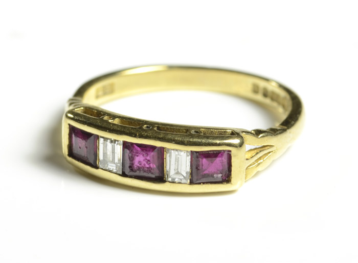 Appraisal: RUBY DIAMOND AND EIGHTEEN KARAT GOLD RING set with three