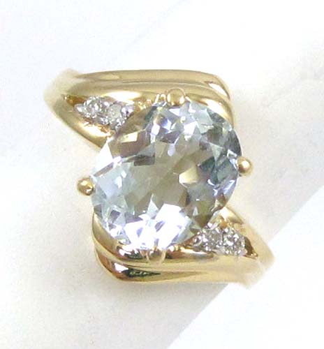 Appraisal: AQUAMARINE DIAMOND AND FOURTEEN KARAT GOLD RING with two pairs