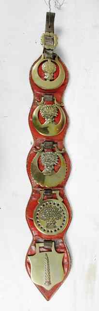 Appraisal: Five horse brasses mounted on a strap