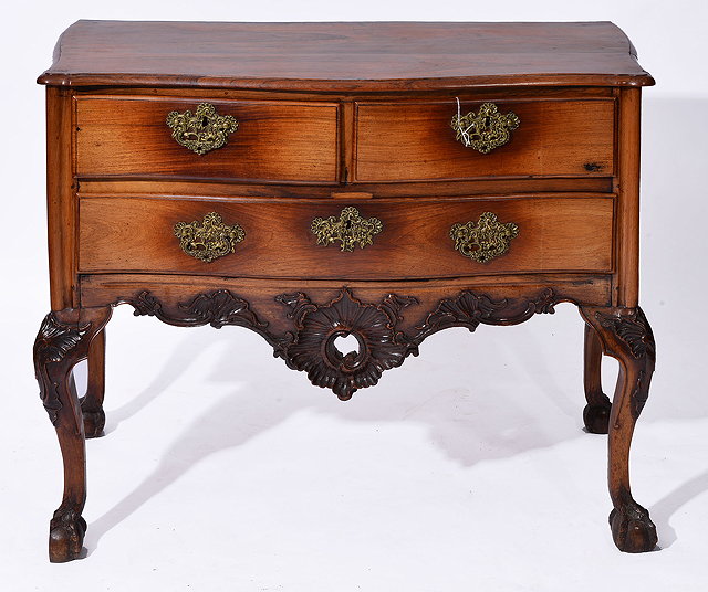 Appraisal: AN TH CENTURY PORTUGESE ROSEWOOD COMMODE of serpentine outline fitted