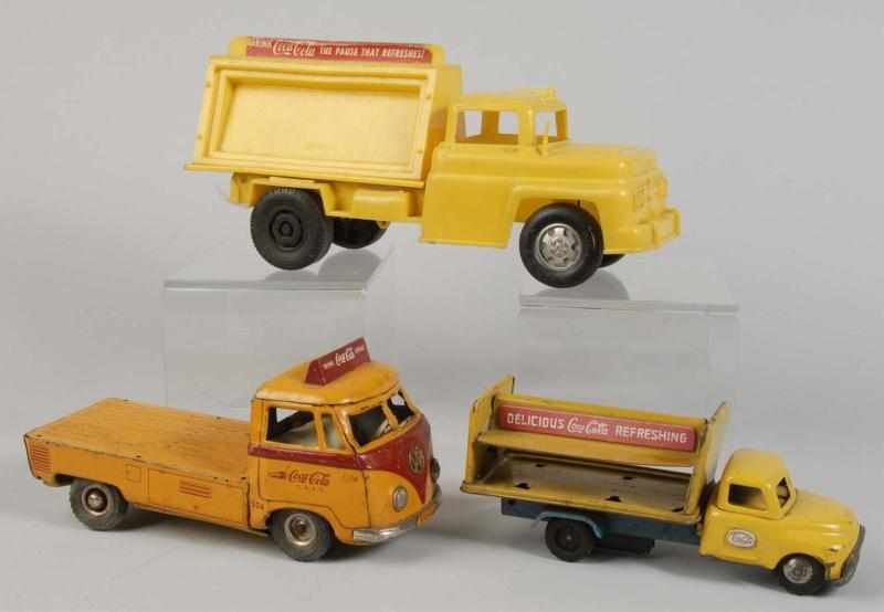 Appraisal: Lot of Assorted Coca-Cola Toy Trucks Description Includes one metal