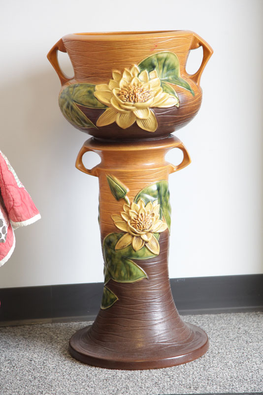 Appraisal: ROSEVILLE JARDINIERE AND PEDESTAL In brown Water Lily pattern Form