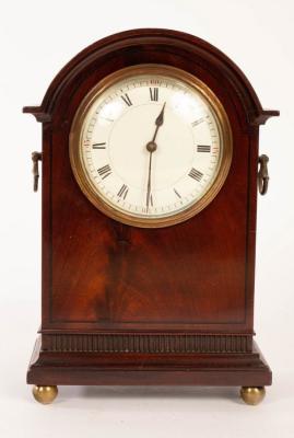 Appraisal: An Edwardian mahogany arch-top mantel clock on four ball feet