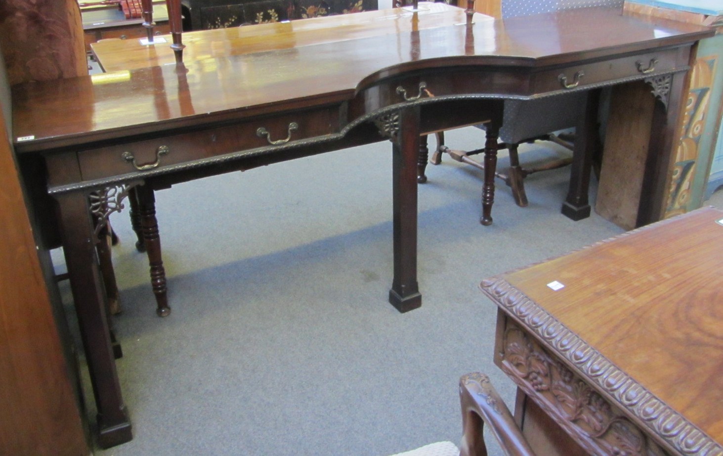 Appraisal: A th century mahogany serving table the semi elliptic concave