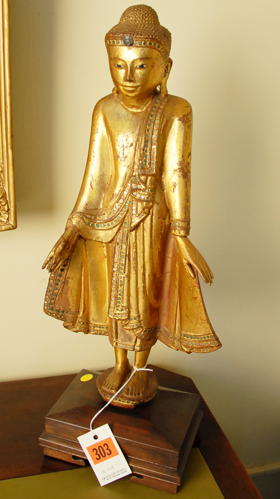 Appraisal: A Standing Buddha Figure of carved gilt and polychromed wood