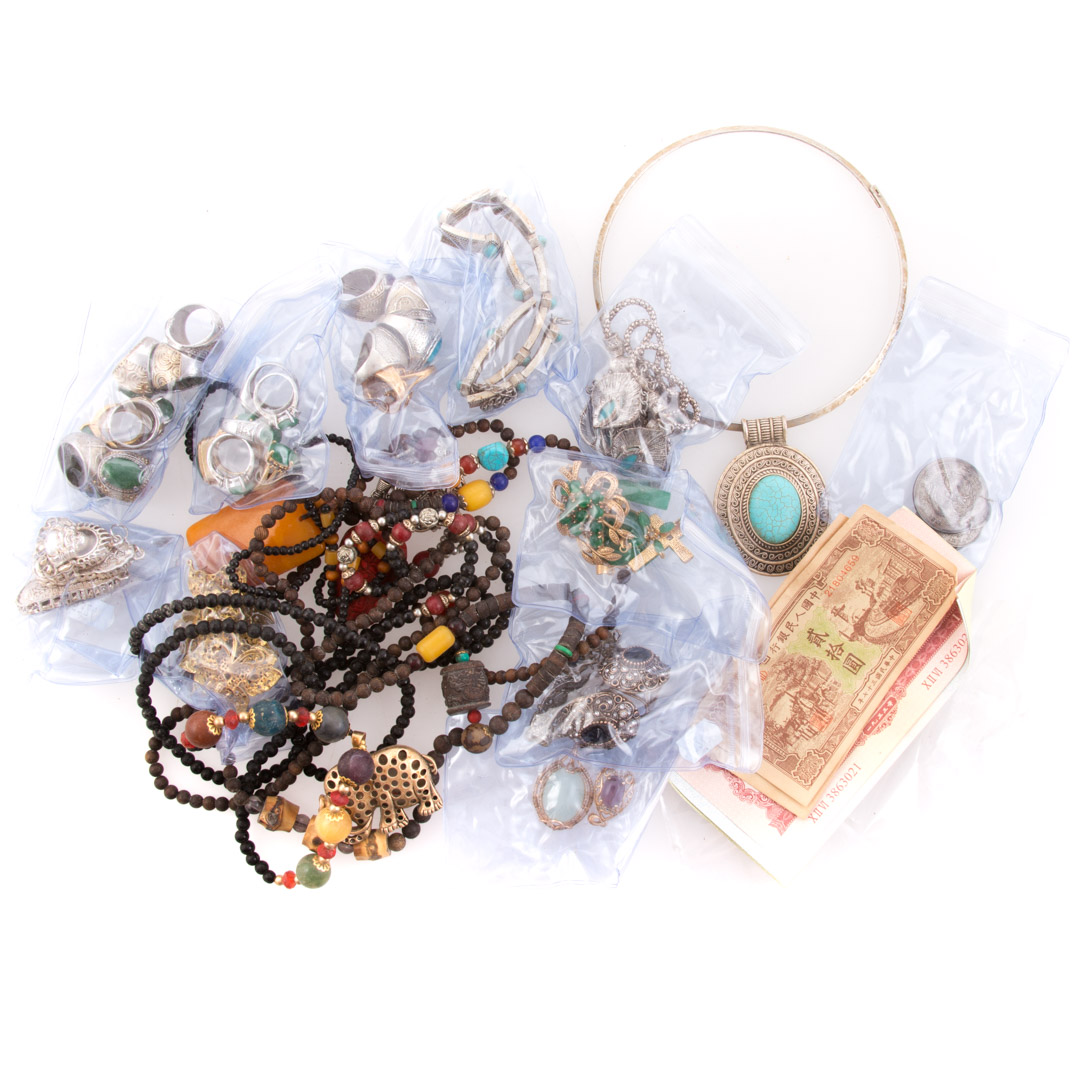 Appraisal: Assorted rings bracelets necklaces and currency bag lot