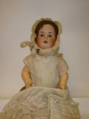 Appraisal: A Schutzmeister Quendt bisque head doll with blue sleeping eyes