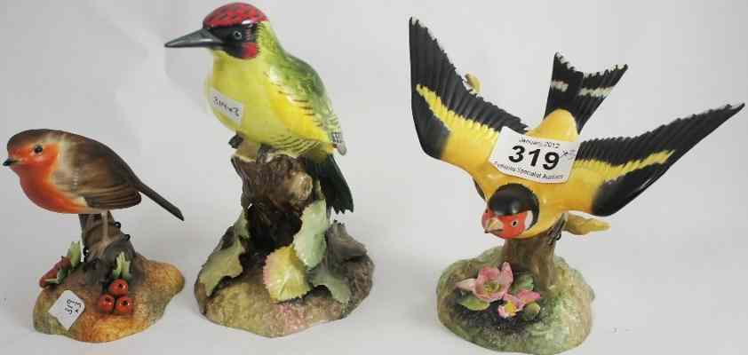 Appraisal: Royal Crown Derby models of Robin Goldfinch and Woodpecker modelled