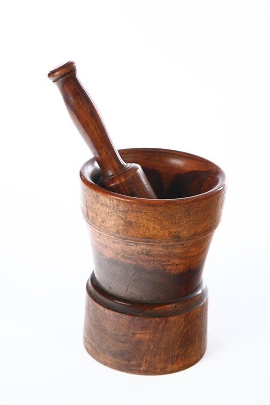 Appraisal: MORTAR AND PESTLE American th century lignum vitae Turned mortar