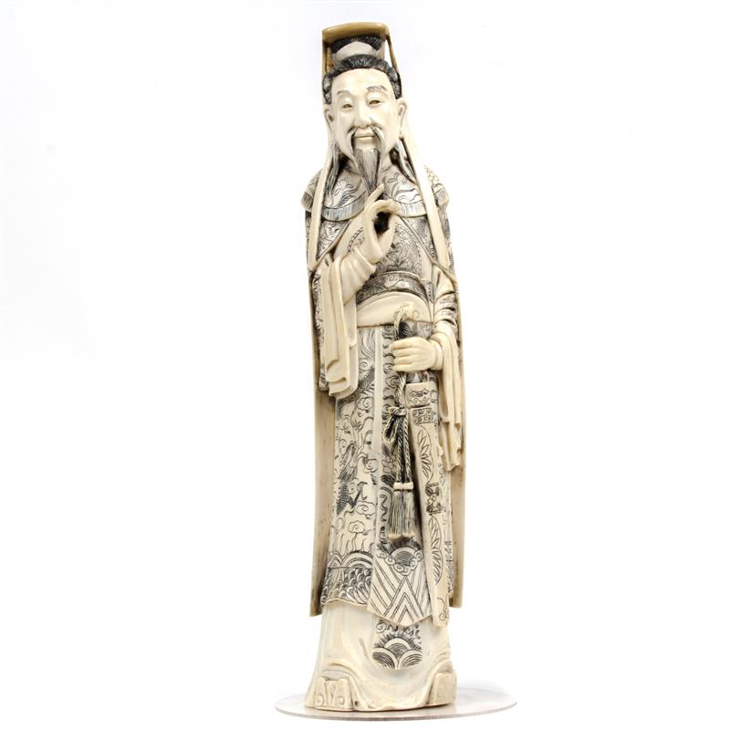 Appraisal: Large Chinese carved ivory figure of nobleman with sheathed sword