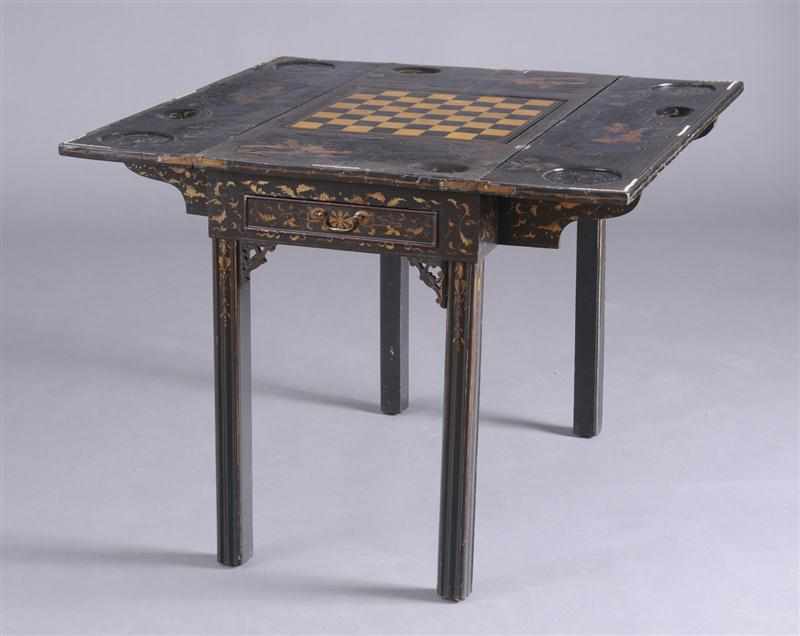 Appraisal: CHINESE EXPORT BLACK LACQUER AND PARCEL-GILT GAMES TABLE The two-flap