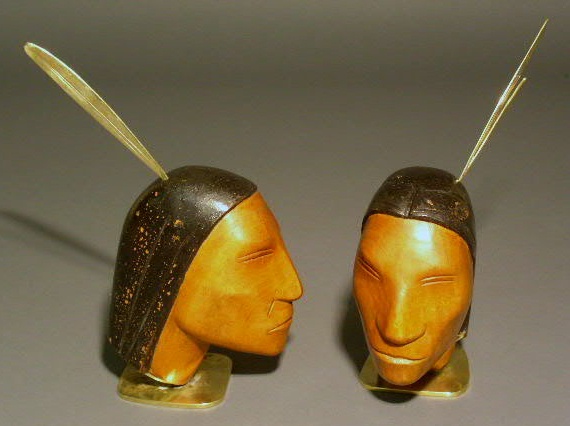 Appraisal: Pair of Haggenauer carved wood Indian scouts with brass bases