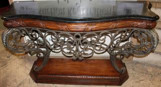 Appraisal: Mahogany and scrolled iron console with veneered marble top h