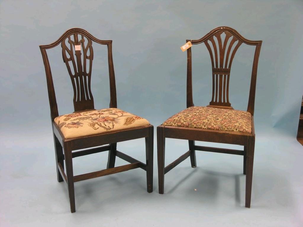 Appraisal: A pair of Hepplewhite-period mahogany dining chairs camel-backs with pierced