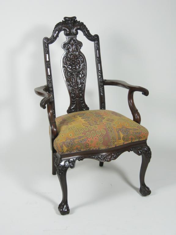 Appraisal: A carved mahogany Elbow Chair with carved splat back scrolled