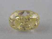 Appraisal: A certificated natural fancy yellow diamond accompanied by Diamond Report