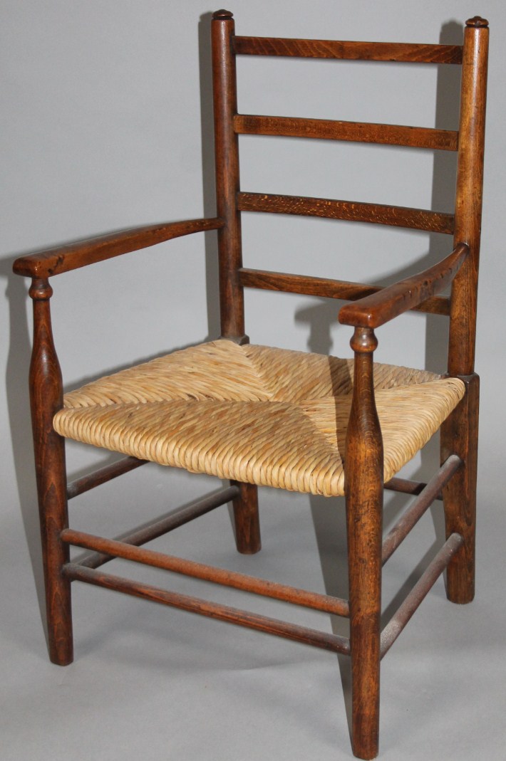 Appraisal: An early thC elm child's chair with plain horizontal slat