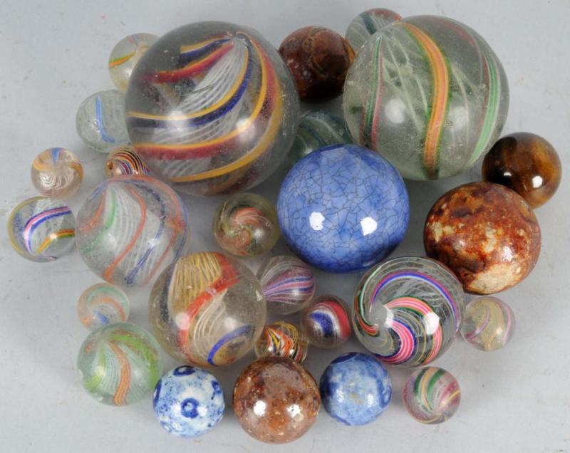 Appraisal: Lot of German Handmade Marbles Description Includes many latticino swirls